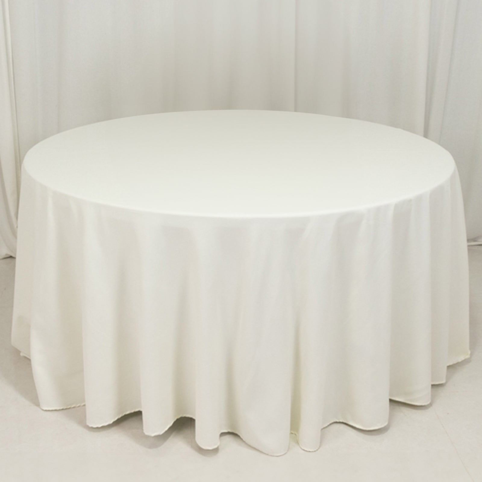 Ivory 120" Cotton Blend Seamless Wrinkle - Resistant Round Tablecloth: Ideal for Events