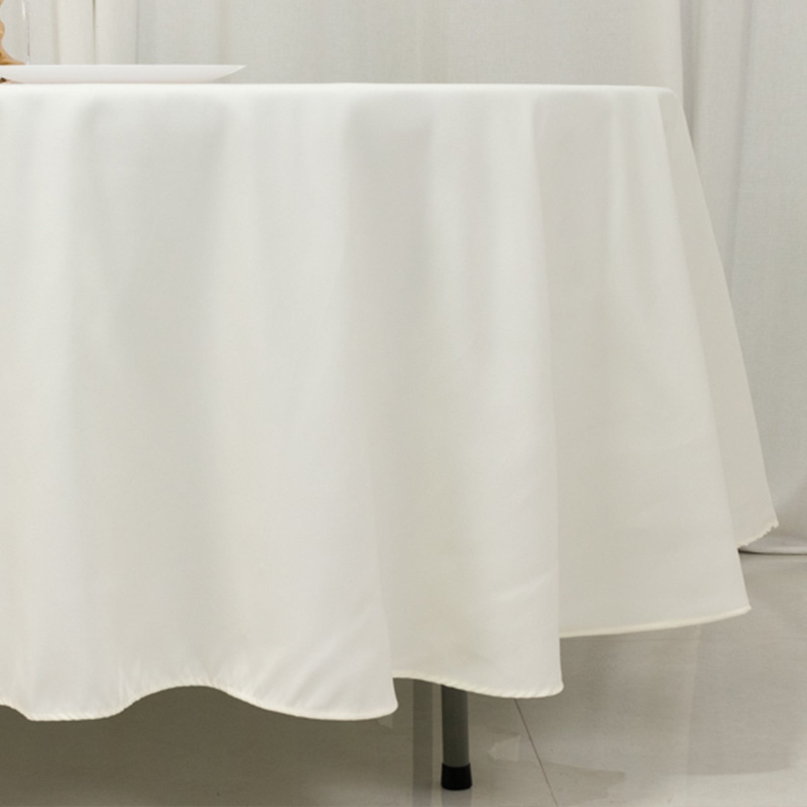 Get This Wrinkle-Resistant Ivory 108-Inch Cotton Blend Round Tablecloth Now
