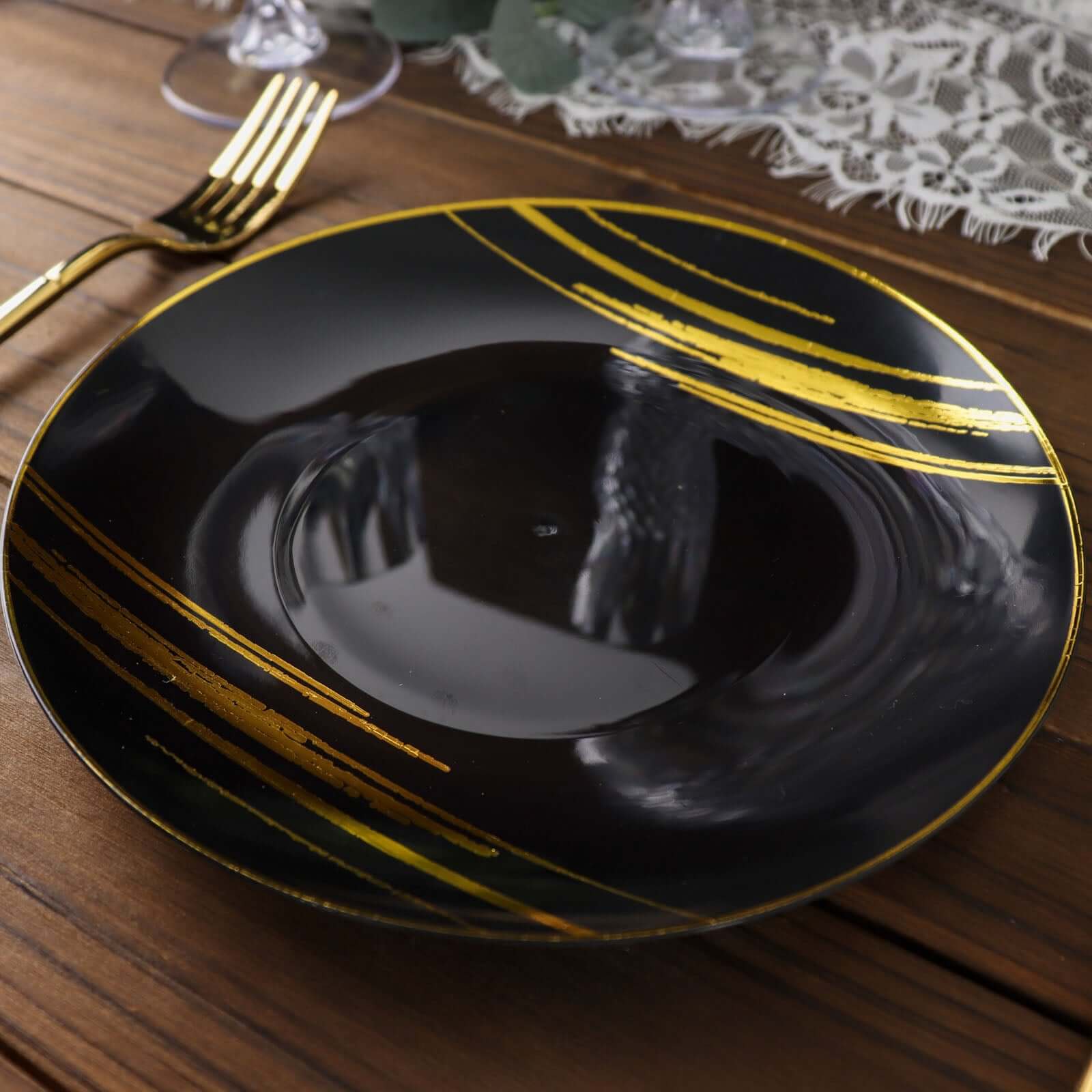 10-Piece Set of Disposable Black Plastic Dessert Plates with Gold Brush Print for Modern Events