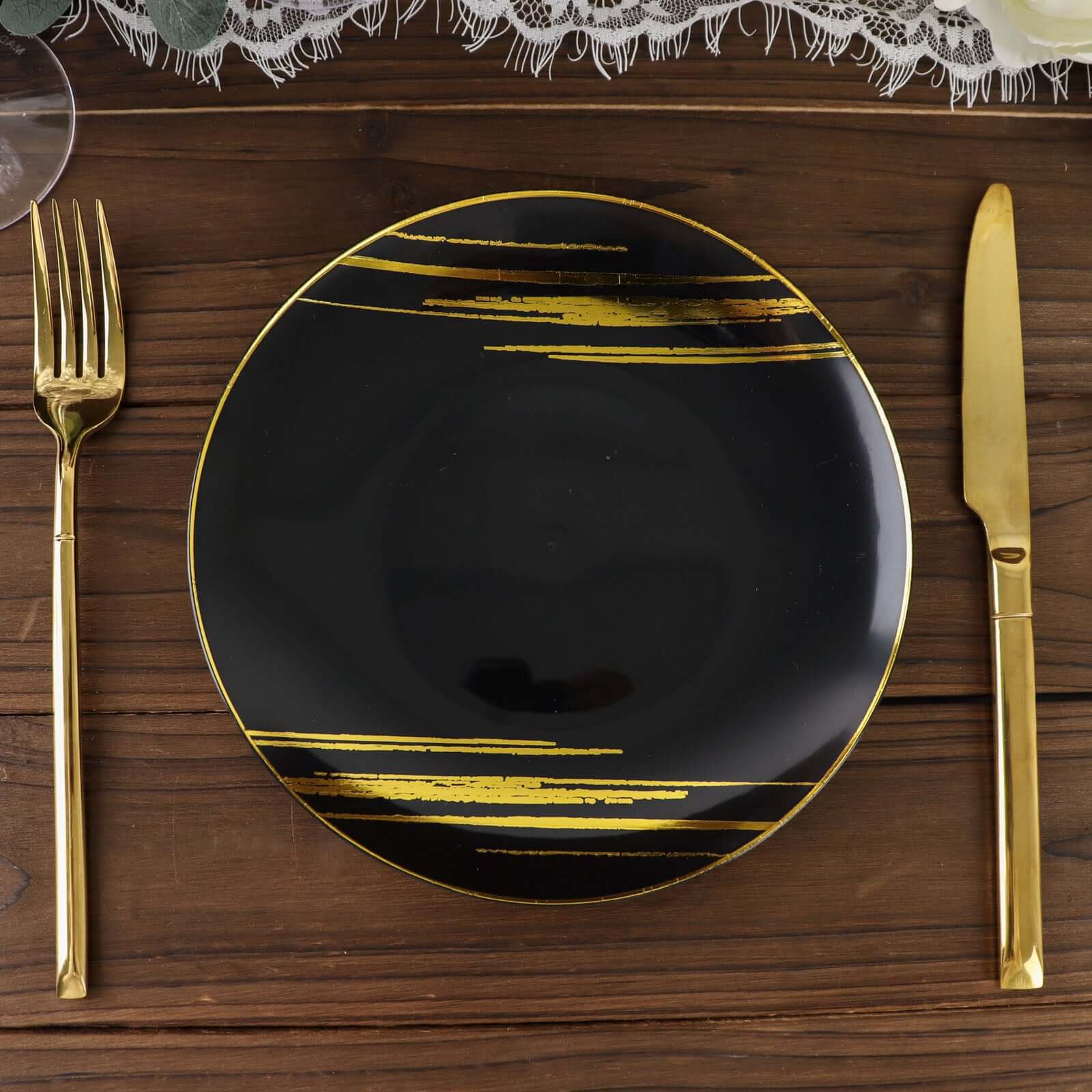 10-Piece Set of Disposable Black Plastic Dessert Plates with Gold Brush Print for Modern Events