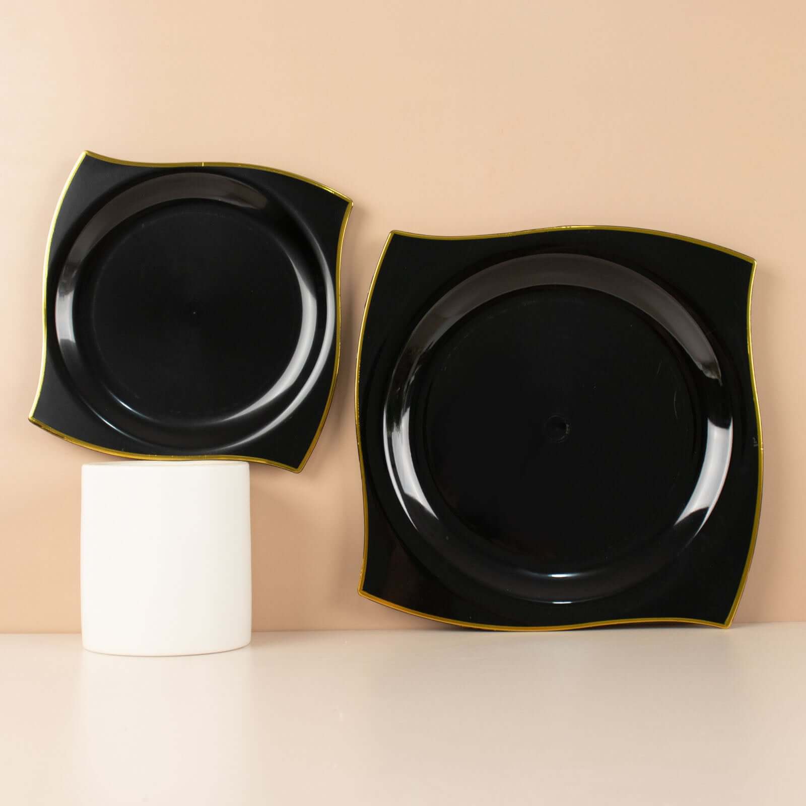 Get 10-Pack Disposable Black Plastic Square Dinner Plates with Gold Wavy Rim for Modern Parties