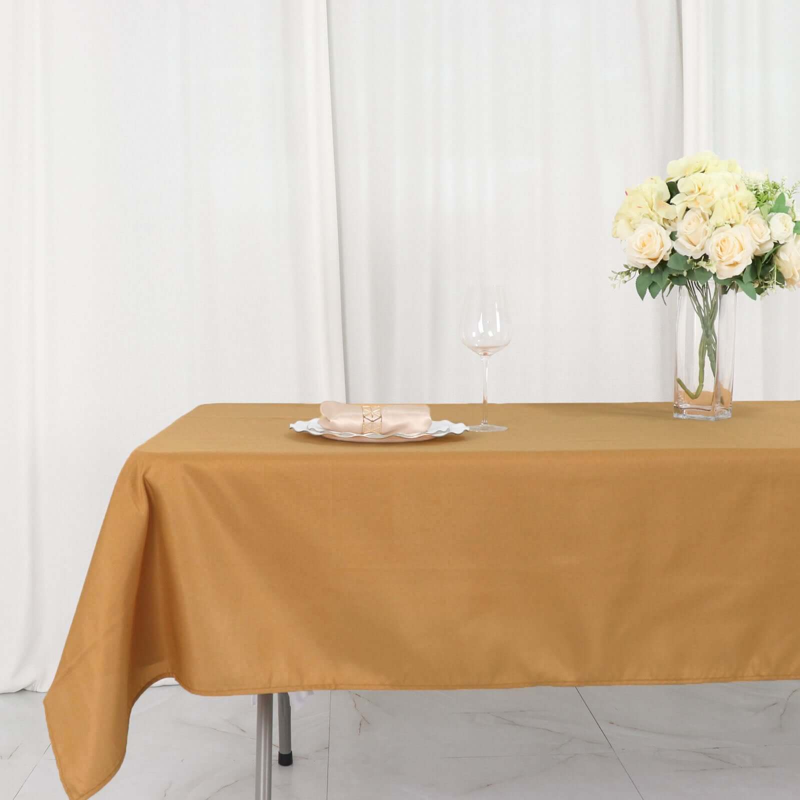 Wrinkle-Resistant Gold Polyester Rectangle Tablecloth 54x96 for Weddings and Events - Easy Care!