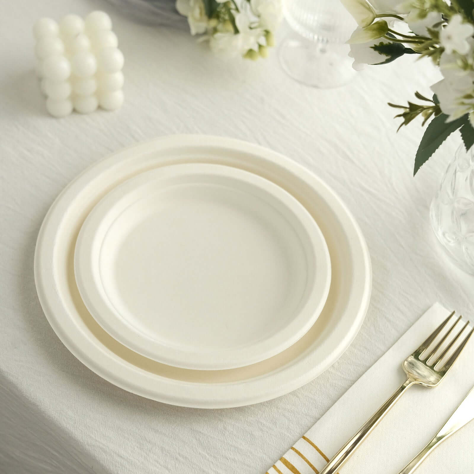 50-Pack White 7" Round Biodegradable Bagasse Dessert Plates - Ideal for Outdoor Events