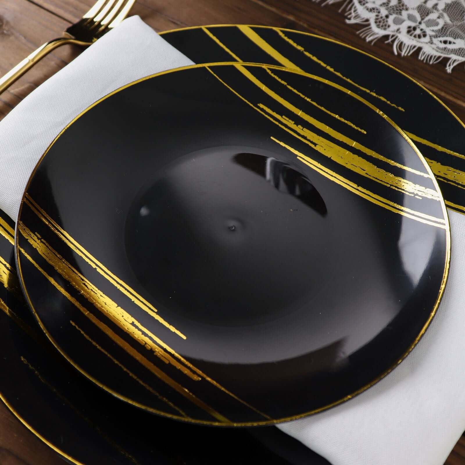 10-Piece Set of Disposable Black Plastic Dessert Plates with Gold Brush Print for Modern Events