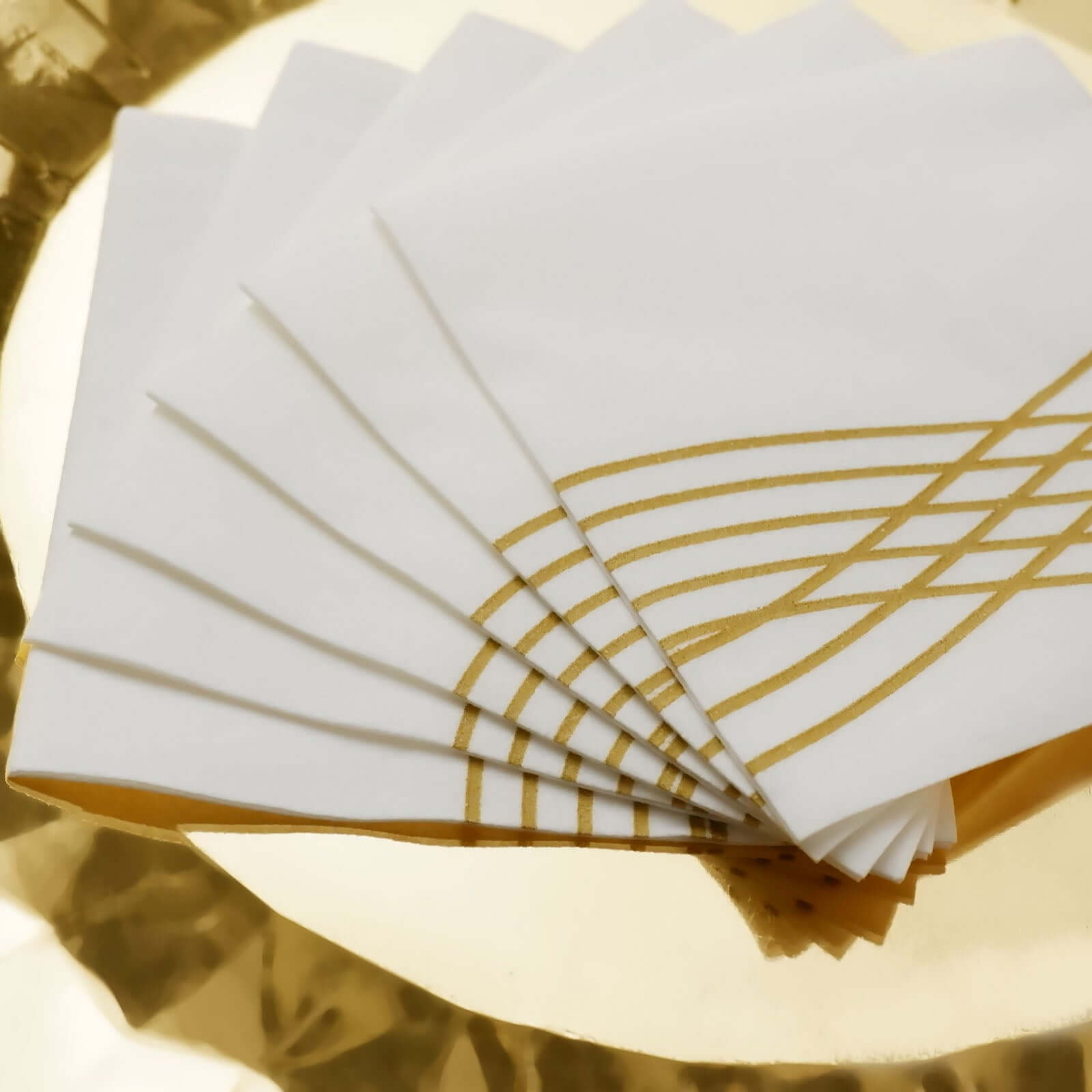 20-Piece Set of White Airlaid Cocktail Napkins with Gold Foil Wave Design