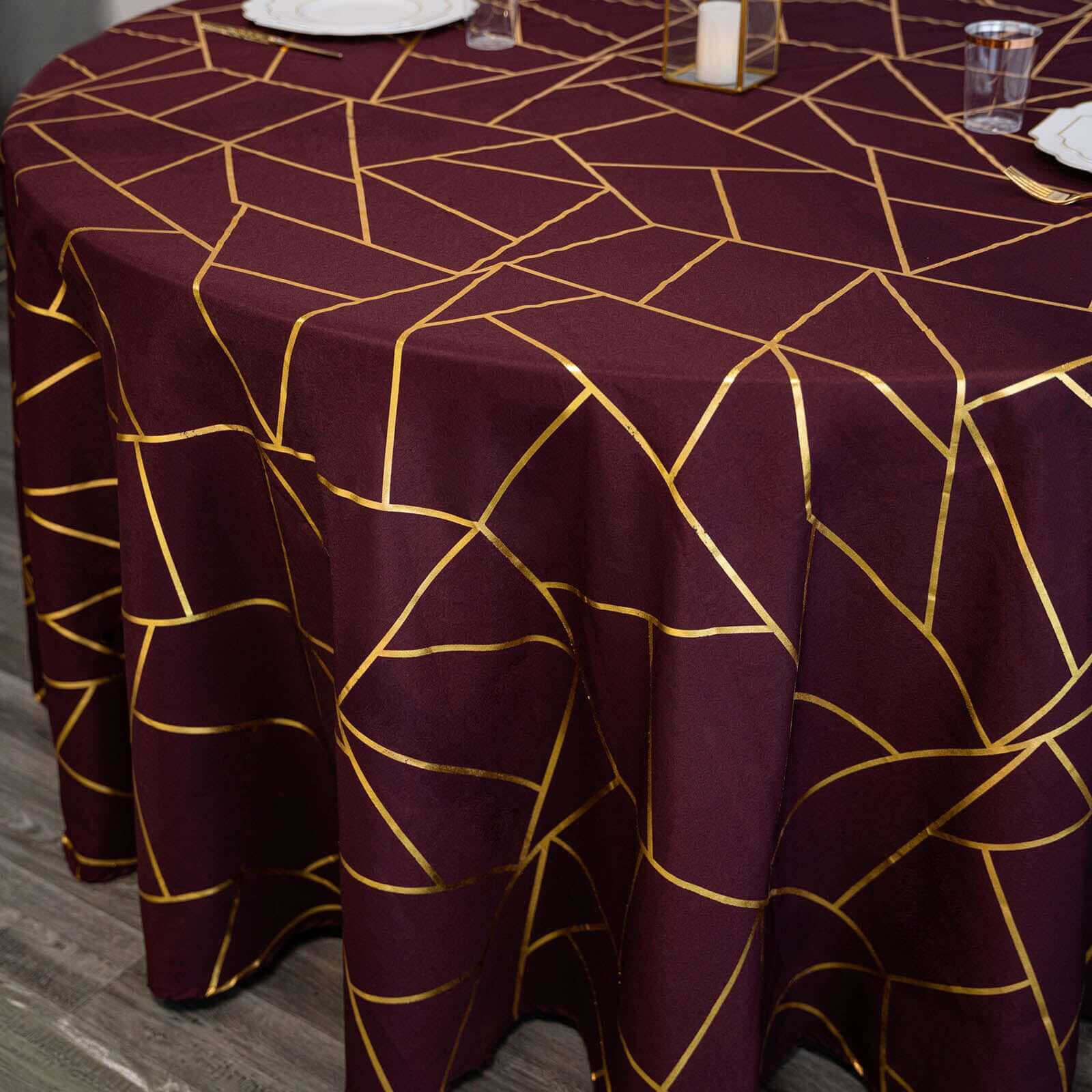Exclusive 120-Inch Burgundy Polyester Seamless Round Tablecloth with Gold Foil Geometric Design for 5-Foot Tables