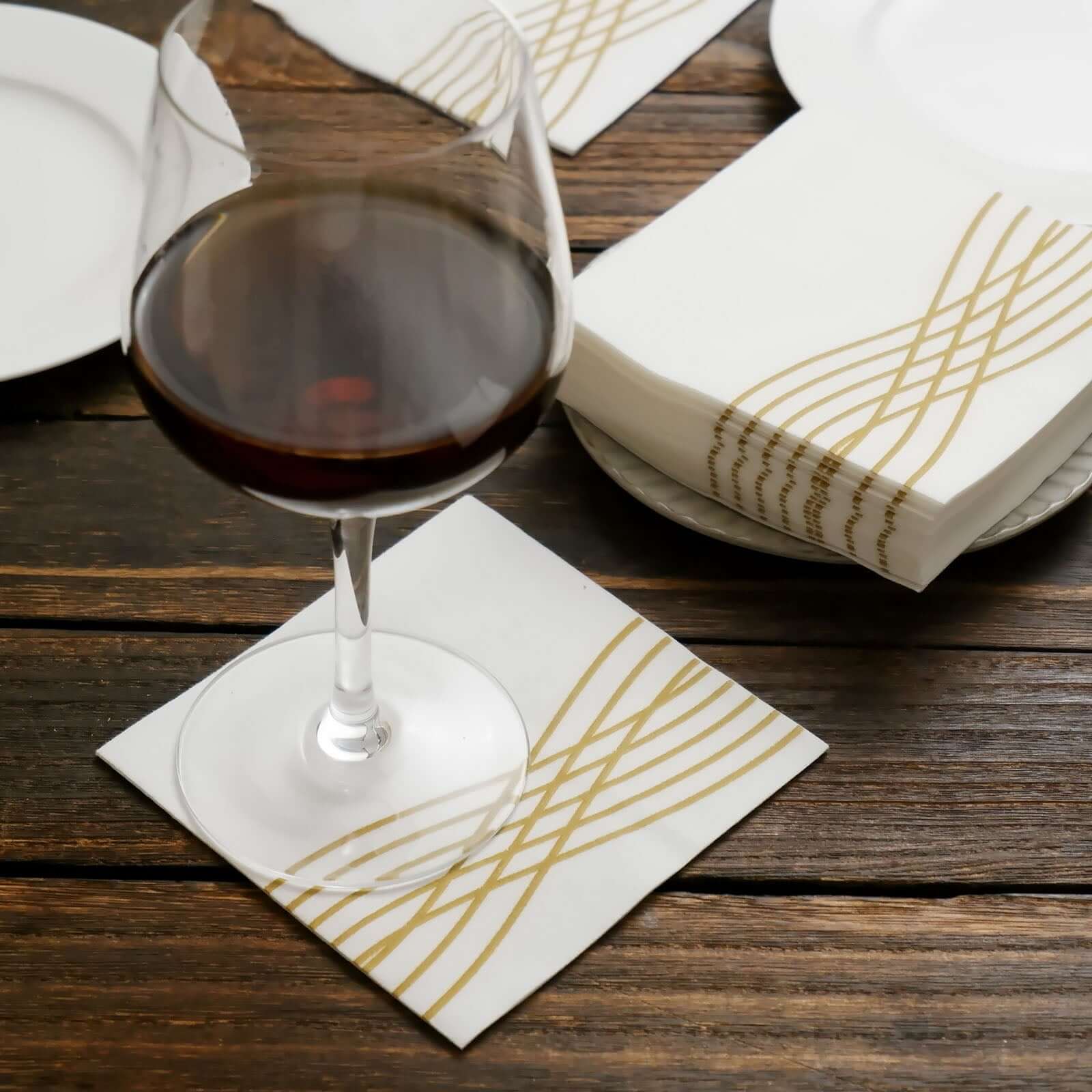 20-Piece Set of White Airlaid Cocktail Napkins with Gold Foil Wave Design