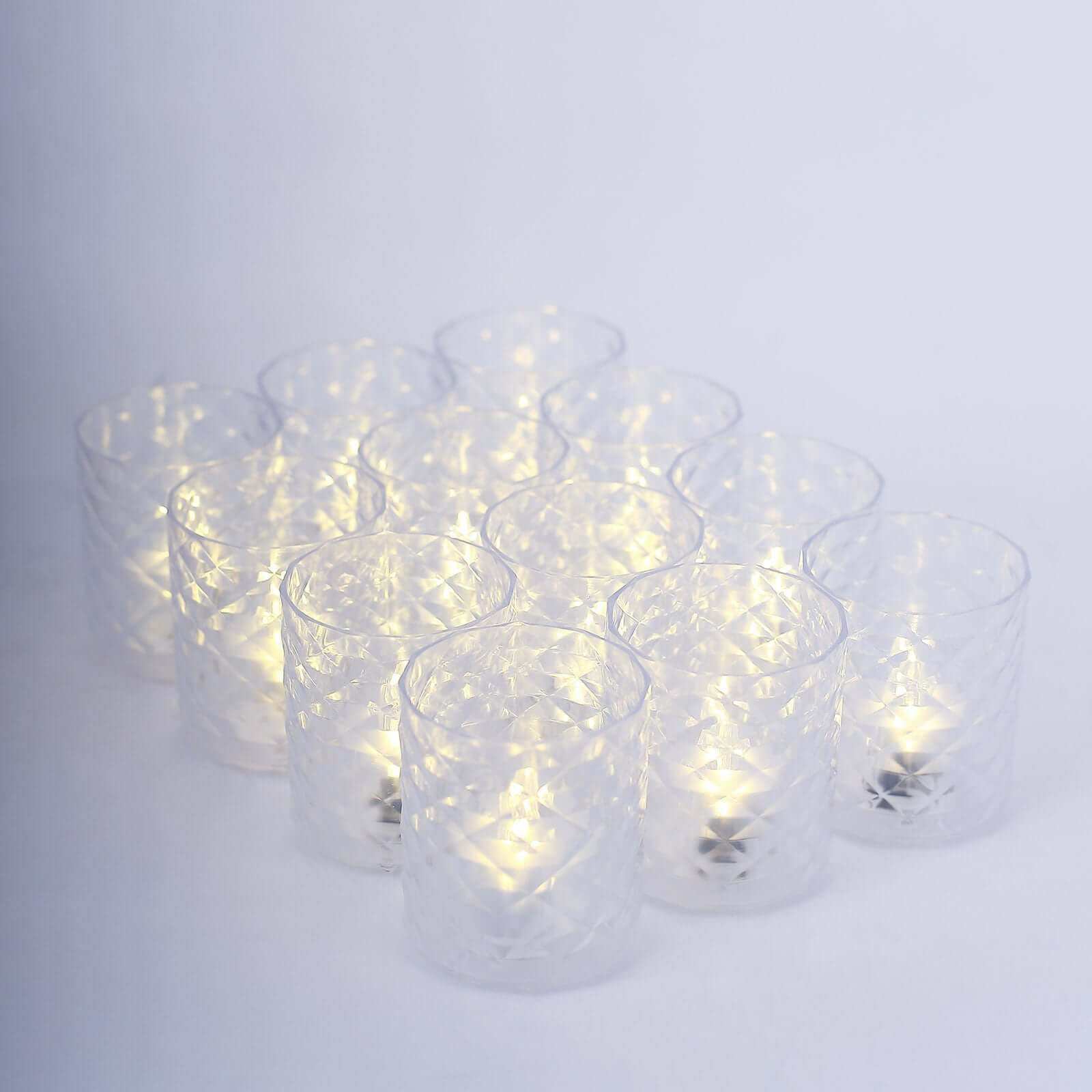 12-Piece Set of Clear LED Tealight Candle Holders in Whiskey Glass Design with Warm White Battery-Operated Lights